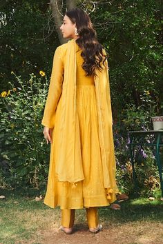 Yellow anarkali featuring scattered mirror work all over with crochet lace embroidered neck and sleeve hem. Paired with pant and a tassel, crochet lace detailed dupatta. - Aza Fashions Tassel Crochet, Yellow Anarkali, Yellow Mirror, Women Kurta, Mirror Work, Set Women, Full Sleeves, Anarkali, Aza Fashion