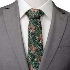 A unique and mesmerizing design, our Kaleido Floral Coral Accented Men's Tie features a coral and green floral kaleidoscope pattern. With a fun and bright design, this tie is sure to be a conversation starter. A versatile style for any event. Our tie will maintain its shape and hold a perfect knot thanks to the durable yet soft 100% Silk. Pairs with our matching floral green and coral kaleidoscope pocket square. Green Floral Tie, Coral And Green, Kaleidoscope Pattern, Coral Accents, Bar Studs, Men's Tie, Green Tie, Baby Boy Shoes, Stud Set