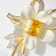 Elevate your outfit with this stunning Copper Yellow Diamond Flower Brooch. Adorned with intricately cut yellow diamonds, this brooch adds a touch of elegance to any ensemble. The perfect accessory for a special occasion or to elevate your everyday look.      Tarnish proof    Water proof    Sleep / Nap proof    Safe for sensitive skin    Wear it while working out &showering    Designed to wear 24/7    If there is no stock, the product will take   60    days to produce    Please leave your usual Diamond Flower Brooch, Sun And Moon Rings, Yellow Diamonds, Flat Back Earrings, Feather Necklaces, Gold Bracelet Chain, Diamond Flower, Blue Zircon, Rose Gold Jewelry