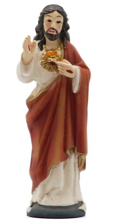 a statue of jesus holding a piece of bread