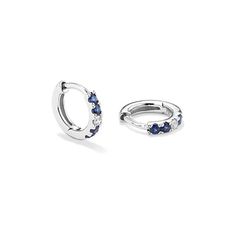 These hoop earrings feature traditional blue natural sapphires and natural diamonds for the perfect touch of color and sparkle. They’re crafted in bright 14-karat white gold with a secure hinge back and a stylish huggie fit  making them great for daily wear. Sapphire Hoop Earrings Fine Jewelry, Blue Sterling Silver Huggie Earrings, Gift Sapphire Hoop Earrings, Fine Jewelry Sapphire Hoop Earrings In White Gold, Ethical Sapphire White Gold Earrings, White Diamond Huggie Earrings, Fine Jewelry, Natural Sapphire, Sapphire Diamond, Natural Diamonds