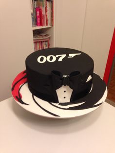 a hat and bow tie cake on a table