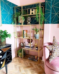 a living room filled with furniture and plants on top of shelves next to a wooden floor