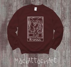 Not everyone is nice during the Christmas season. This Krampus Tarot Card Christmas Sweater is the perfect gift to segue into the Christmas Season from the Spooky Vibes of Halloween. This warm cozy sweater features a graphic of Krampus himself with a witchy/witchcraft tarot card design. Grab yours today before the holiday season! ** ABOUT ** * 50% cotton, 50% polyester * Pre-shrunk * Classic fit * 1x1 athletic rib knit collar with spandex * Air-jet spun yarn with a soft feel and reduced pilling * Double-needle stitched collar, shoulders, armholes, cuffs, and hem This product is made especially for you as soon as you place an order, which is why it takes us a bit longer to deliver it to you. Making products on demand instead of in bulk helps reduce overproduction, so thank you for making th Christmas Tarot, Witchcraft Tarot, Krampus Christmas, Crewneck Aesthetic, Aesthetic Sweatshirt, Trendy Crewneck, Karten Design, Spooky Vibes, Card Christmas