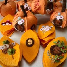 several pieces of felt with pumpkins and flowers on them