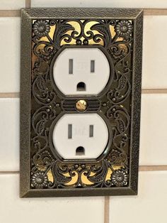 an ornate light switch plate covers the entire wall