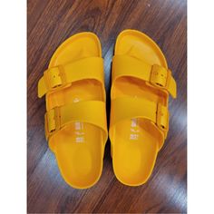 Nwot Birkenstock Arizonas In Perfect, Never-Worn Condition! Contoured Footbed, Water-Proof And Flexible Plastic Material. Unisex Size 38, Women's Size 77.5 And Men's Size 55.5. Tangerine Orange Color. Super Fun! Yellow Round Toe Slides For The Beach, Yellow Round Toe Slides For Beach, Yellow Flat Slides For Vacation, Casual Yellow Flip Flops With Cushioned Footbed, Yellow Flat Slides For Beach, Yellow Summer Slides For Beach, Casual Yellow Cushioned Flip Flops, Casual Yellow Slides For Vacation, Yellow Synthetic Slides For The Beach