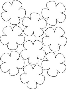 four leaf clovers are arranged in the shape of a heart, as if they were cut out from paper