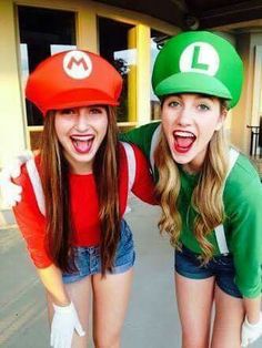 two women dressed in mario and luigi hats