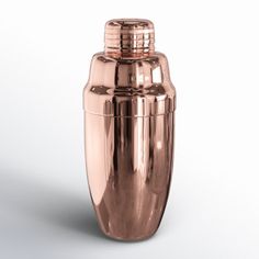 a copper colored cocktail shaker on a white background