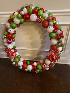 a christmas wreath made out of balls and ornaments