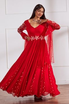 Red padded anarkali with placed pearl embellished sleeves and can can attached embroidered skirt. Comes with matching dupatta and belt.
Components: 3
Pattern: Embroidered
Type Of Work: Cutdana,Sequin,Pearl
Neckline: V-neck
Sleeve Type: Full
Fabric: Opada silk, Georgette, Net, Lining: Shantoon
Color: Red
Other Details: 
Attached lining
Fit and flare silhouette
Closure: Side zip
Occasion: Mehendi and Haldi,Sangeet - Aza Fashions Navratri Hand Embellished Anarkali Set, Festive Bollywood Style Hand Embellished Salwar Kameez, Hand Embellished Dupatta For Navratri, Hand Embellished Dupatta For Festive Navratri, Anarkali Hand Embellished Salwar Kameez For Festive Occasions, Long Sleeve Anarkali Set With Mirror Work For Reception, Festive Anarkali Traditional Wear Hand Embellished, Red Anarkali Set For Reception During Eid, Hand Embellished Georgette Anarkali Set For Diwali