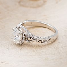 a white gold engagement ring with an oval cut diamond