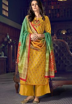 yellow art silk straight suit with jacquard printed dupatta 5008  Desc:  Yellow Art Silk Straight Suit with Jacquard Printed Dupatta. Comes with matching Inner Shantoon and bottom Art Silk with Cotton dupatta. Slight variation in color fabric and work is possible. Model images are only representative. Designs  patterns and colors may slightly vary from the actual color vs. image due to screen resolution or photography lights.Accessories and other item shown in picture is used for photography wil Mustard Suit, Women Salwar Suit, Diwali Dresses, Trouser Suit, Silk Bottoms, Blue Embroidery, Suits For Sale, Pakistani Suits, Printed Trousers