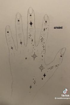 a drawing of a hand with stars and the words aris written on it in black ink