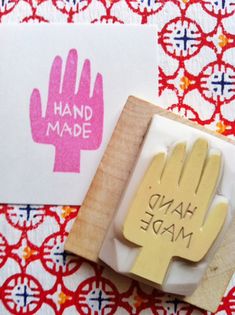 a rubber stamp that says hand made on it