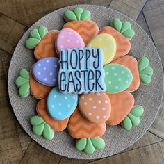 a decorated cookie with the words happy easter on it