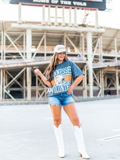 Stand out with this University of Tennessee Oversized All-Over Mini Rhinestone Tee! Featuring an all over rhinestone design of the Tennessee Volunteers helmet, this graphic tee is perfect for any fan looking to add some sparkle to their game day outfit. Game on! Trucker Hat Fashion, Rhinestone Tees, Gameday Dress, Game Day Outfit, University Of Tennessee, Tennessee Volunteers, Gameday Outfit, Outerwear Vest, Rhinestone Designs