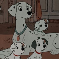 the dalmatian puppies are sitting on the floor