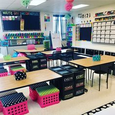 an empty classroom with desks, chairs and chalkboards on the wall in front of them