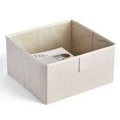 a white storage box with a book inside