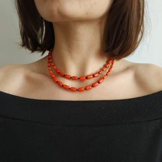 < Coral necklace with black beads > This product made according to the model of authentic traditional Ukrainian jewelry. The coral is modern, the design is vintage. Like 99% of the coral on the market these days, this coral has been dyed. I use bamboo coral which is not endangered or threatened in any way, unlike natural pink or red coral (the production of which is forbidden almost everywhere in the world). Bamboo coral doesn't mean it's not organic. Every bead of it has a distinctive and Orange Oval Beaded Necklaces As Gifts, Orange Oval Beaded Necklace For Gifting, Orange Oval Beaded Necklace For Gift, Orange Necklace With Black Round Beads, Orange Necklace With Black Beads For Gift, Gift Necklace With Orange And Black Beads, Orange Double Strand Beaded Necklace As Gift, Orange Double Strand Beaded Necklace For Gift, Coral Necklaces