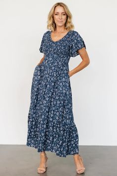 Joanie Smocked Dress | Clove Floral | Baltic Born Casual V-neck Midi Dress With Smocked Back, Blue V-neck Midi Dress With Ditsy Floral Print, Blue V-neck Midi Dress With Smocked Bodice, Blue V-neck Maxi Dress With Elastic Waistband, Blue Floral Print Empire Waist Dress, Blue Empire Waist Dress With Floral Print, Spring Blue Midi Dress With Elastic Waistband, Casual Blue Maxi Dress With Ditsy Floral Print, Blue V-neck Maxi Dress With Smocked Back