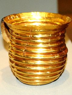 a stack of gold rings sitting on top of a table