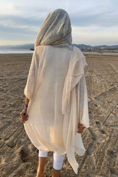 Ivory 100% Cotton Hooded Cloak. Great as a Festival or a Ceremony Clothing. This amazing long soft knit kimono with the hood is handmade from a high quality cotton knits fabric. Please note, we work with upcycled fabrics and sometimes we ran out of the particular knits and we are replacing them with the similar knit fab White Long Sleeve Cardigan For Beach Cover-up, White Oversized Cardigan For The Beach, Oversized White Cardigan For Beach, White Oversized Long Sleeve Cover-up, Long White Cardigan For The Beach, White Long Cardigan For The Beach, White Long Sleeve Cover-up For Fall, Long Cream Cardigan For The Beach, Long Cream Cardigan For Beach