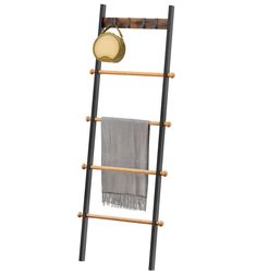 a ladder that has a towel on it and a light hanging off the side of it