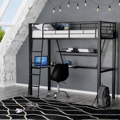 a loft bed with desk underneath it