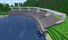 a large bridge over a body of water in a minecraft style area with lots of trees