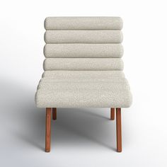 a white chair with four wooden legs