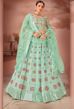 This exquisite Multicolour Lehenga Choli is crafted with premium Georgette and Raw Silk, ensuring a luxurious and high-quality piece. With its stunning design and materials, this dress offers a sophisticated and elegant look for any occasion. Elevate your wardrobe with this must-have piece. LEHENGA FABRIC: Premium Georgette, Premium Net BLOUSE FABRIC: Premium Georgette, Premium Raw Silk DUPATTA: Net SIZING: Can be stitched upto 42 inches bust and waist SHIPPING: The product will be shipped withi Plain Lehenga, Plus Size Lehenga, Green Lehenga Choli, Heavy Lehenga, Raw Silk Lehenga, Georgette Lehenga, Grey Saree, Sea Green Color, Net Blouses