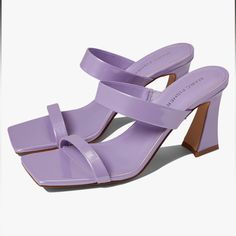 Stay On Trend In The Fashion Forward Marc Fisher Zasha Sandal. Slip On Style. Square Open Toe Silhouette. Padded Footbed Offers Lasting Comfort. Covered Block Heel. Man-Made Upper, Lining, Insole, And Outsole. Purple Block Heel Sandals In Synthetic Material, Purple Block Heel Sandals In Synthetic, Purple Synthetic Sandals With Block Heel, Purple Sandals With Padded Heel For Summer, Purple Stacked Heel Heels For Spring, Spring Purple Heels With Stacked Heel, Spring Purple Open Toe Mules, Spring Season Purple Open Toe Mules, Summer Purple Mules