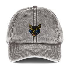 This acid wash dad hat features Timelements embroidered design Mad Cat. A fierce, funky icon that will add a feline beat to your casual everyday outfit. Punk rock, wild, fun.   Features:   • TimeElements Mad Cat embroidered design  • 100% cotton twill - Acid wash • Low profile, 6-panel, unstructured cap •Metal snap buckle with an antique brass finish  Shipping from the USA Outfit Punk, Mad Cat, Dad Cap, Dad Caps, Everyday Outfit, Embroidery Details, Dad Hat, Casual Everyday, Vintage Cotton