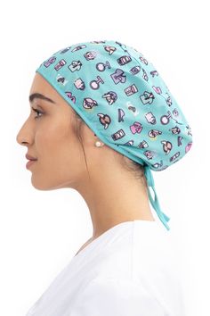 a woman wearing a surgical scrub hat