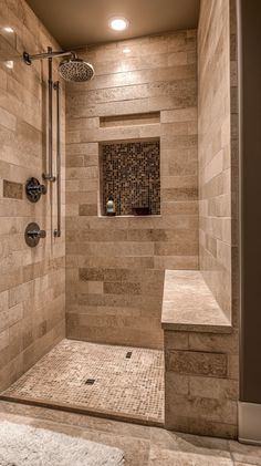 a walk in shower sitting next to a white rug on top of a tiled floor