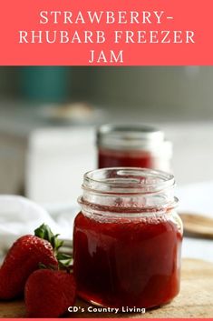 strawberry rhubarb freezer jam in a jar with strawberries on the side