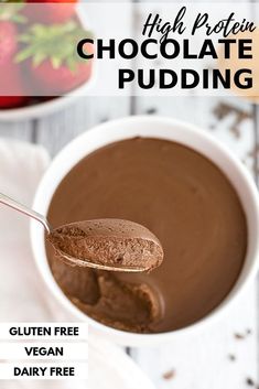 a spoon full of chocolate pudding with the words high protein chocolate pudding on it and strawberries in the background