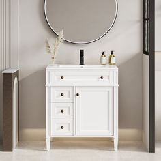 a bathroom vanity with a round mirror above it