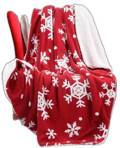 a red and white blanket with snowflakes on it