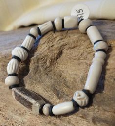 Bone bead stretchy bracelet. Bones are hand carved water buffalo beads. Roll on to your wrist. Bracelet is 6.5 inches. Fits comfortably on my 7.5 inch wrist. Bone Bracelet, Bones Bracelet, Wrist Bracelet, Water Buffalo, Bone Beads, Stretchy Bracelets, Roll On, Arm Band, Bones