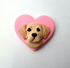 a dog's head is shown in the shape of a heart on a white surface