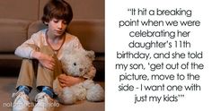 a young boy sitting on the floor holding a teddy bear