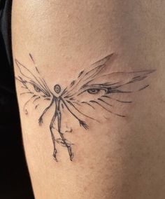 a woman's leg with a tattoo on it that has an image of a winged bird