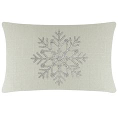 an embroidered pillow with snowflakes on it