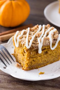 a slice of pumpkin coffee cake on a plate with a fork