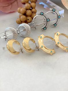 Introducing our exquisite Hoop Earrings collection, featuring two stunning designs in an array of captivating colors. Fall in love with our first design - a bold, enamel-coated pair embellished in vibrant turquoise. Alternatively, our second design boasts an irresistible allure with unique wave patterns. Choose from a timeless silver or luxurious gold finish, while enjoying the added benefit of titanium studs for enhanced allergy protection. Crafted to perfection, these lightweight earrings deli Tiny Pendant, Statement Hoop Earrings, Hoop Earrings Gold, Earrings Geometric, Tiny Earrings, Beaded Anklets, Large Hoop Earrings, Earrings Stud, Modern Earrings