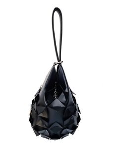 Accessories can make or break an outfit and none speak louder than a bold statement bag. Due to its timeless shape, this bucket bag can be worn effortlessly throughout the year. Carry it on the wrist or hold it for a contemporary take on evening dressing. Our Star Bucket bag is like a precious ornament that will add a luxury and edgy touch to your every look. She's crafted from quality vegan leather to a water-drop silhouette. It's signature three-dimensional geometric surface is punctuated by s Black Metal Rings, Statement Bag, Metal Rings, Silver Color, Bucket Bag, Vegan Leather, The Year, Candy, Stars